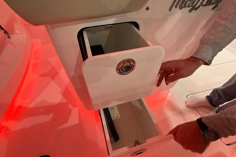 Slide: The Image of Engine compartment of 2021 Mag Bay 33 CC boat, showcasing mechanical components and piping. - 60