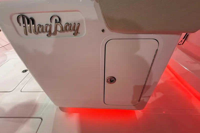 Slide: The Image of 2021 Mag Bay 33 CC boat compartment with visible plumbing and storage area. - 64