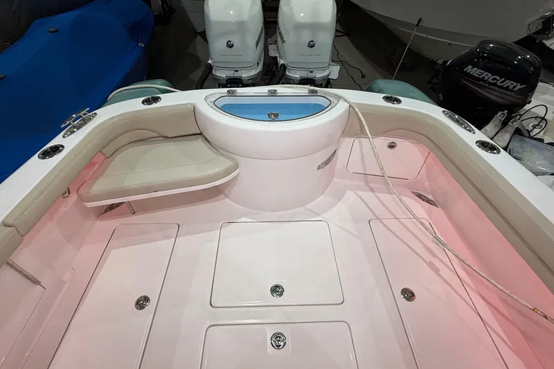 Slide: The Image of 2021 Mag Bay 33 CC boat interior compartment with hoses and fittings. - 65