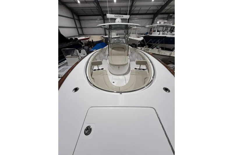 Slide: The Image of Open storage compartment on 2021 Mag Bay 33 CC boat, featuring sleek design and ample space. - 82