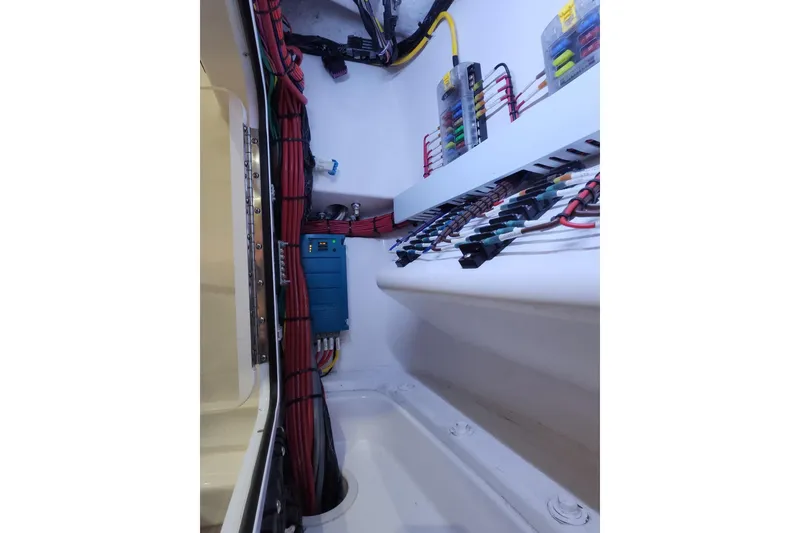 Slide: The Image of Electrical wiring and components inside a 2021 Mag Bay 33 CC boat. - 99