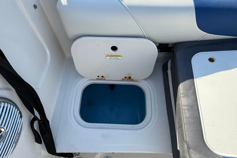 Slide: The Image of Interior of a 2016 Tahoe 450 TS boat showing a storage compartment. - 10