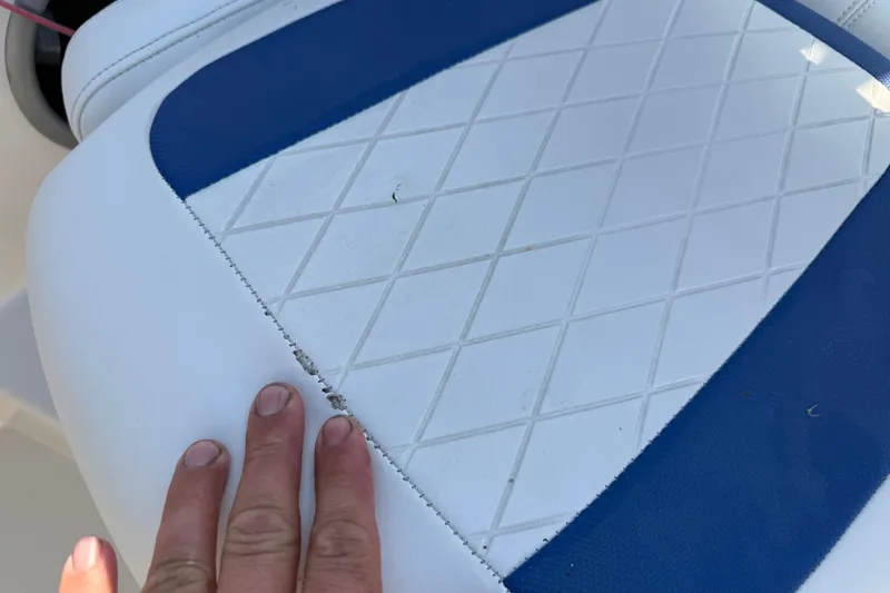 Slide: The Image of Close-up of 2016 Tahoe 450 TS boat seat with blue and white diamond pattern. - 16