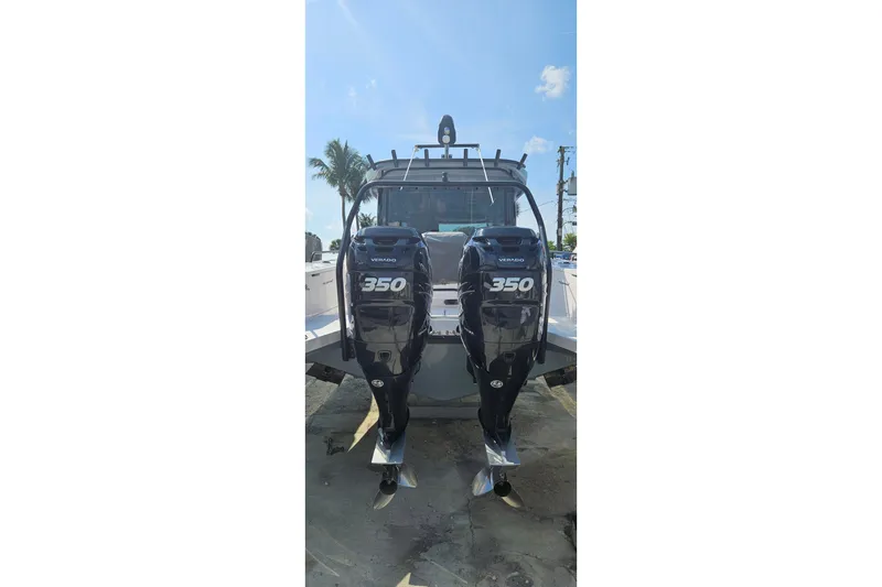 Slide: The Image of 2021 Axopar 37 XC Cross Cabin with twin 350 HP outboard engines. - 4