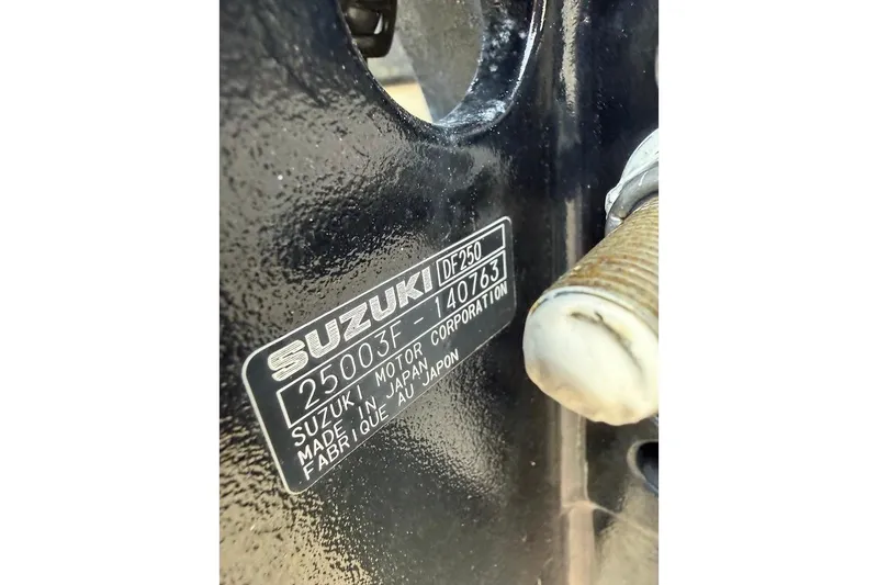 Slide: The Image of Close-up of Suzuki DF250 motor label on a 2002 Boston Whaler boat. - 19