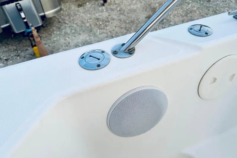 Slide: The Image of 2002 Boston Whaler boat interior with speaker and metal fittings. - 34