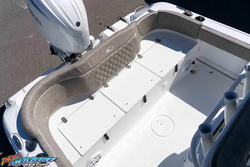 Slide: The Image of 2026 Sea Hunt Ultra 229 boat interior with cushioned seating and storage compartments. - 10
