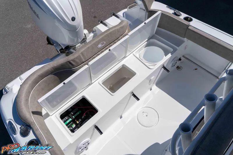 Slide: The Image of 2026 Sea Hunt Ultra 229 boat interior with storage compartments and seating. - 11