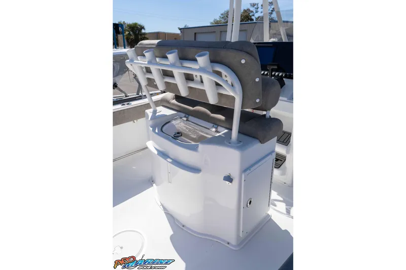 Slide: The Image of 2026 Sea Hunt Ultra 229 boat interior with rod holders and seating. - 12