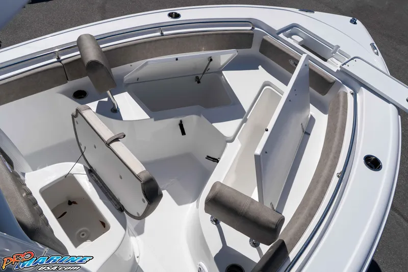 Slide: The Image of 2026 Sea Hunt Ultra 229 boat interior with open storage compartments and seating. - 20