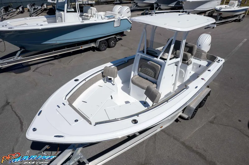 Slide: The Image of 2026 Sea Hunt Ultra 229 boat on trailer, white exterior, spacious deck, modern design. - 31