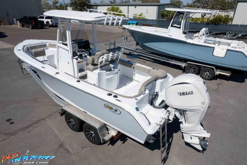 Slide: The Image of 2026 Sea Hunt Ultra 229 boat with Yamaha engine on trailer in parking lot. - 36