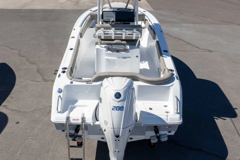 Slide: The Image of 2026 Sea Hunt Ultra 229 boat with Yamaha 200 engine, viewed from the rear. - 39