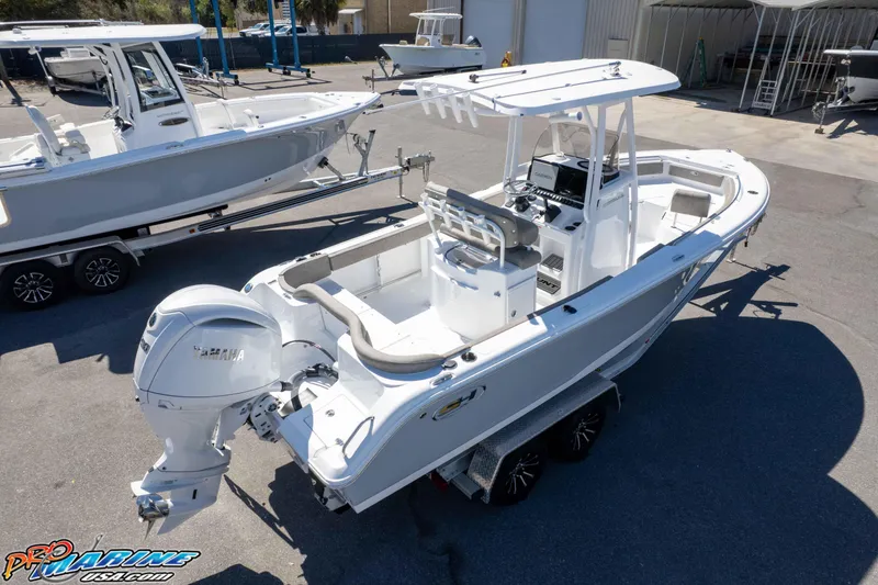 Slide: The Image of 2026 Sea Hunt Ultra 229 boat with Yamaha engine on trailer, parked outdoors. - 41