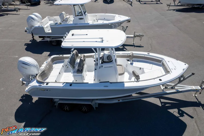 Slide: The Image of 2026 Sea Hunt Ultra 229 boat on trailer, featuring Yamaha outboard motor. - 44