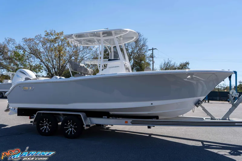 Slide: The Image of 2026 Sea Hunt Ultra 229 boat on trailer, side view, outdoors. - 5
