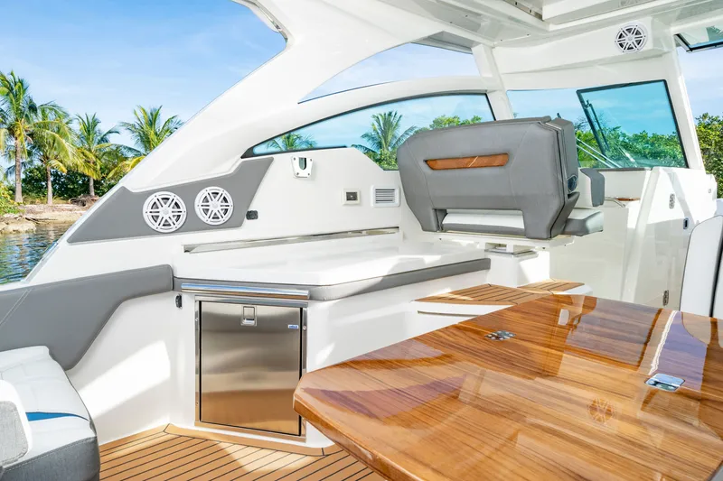 Slide: The Image of Luxurious interior of a 2027 Tiara Yachts 34lx with sleek seating and a wooden table. - 6