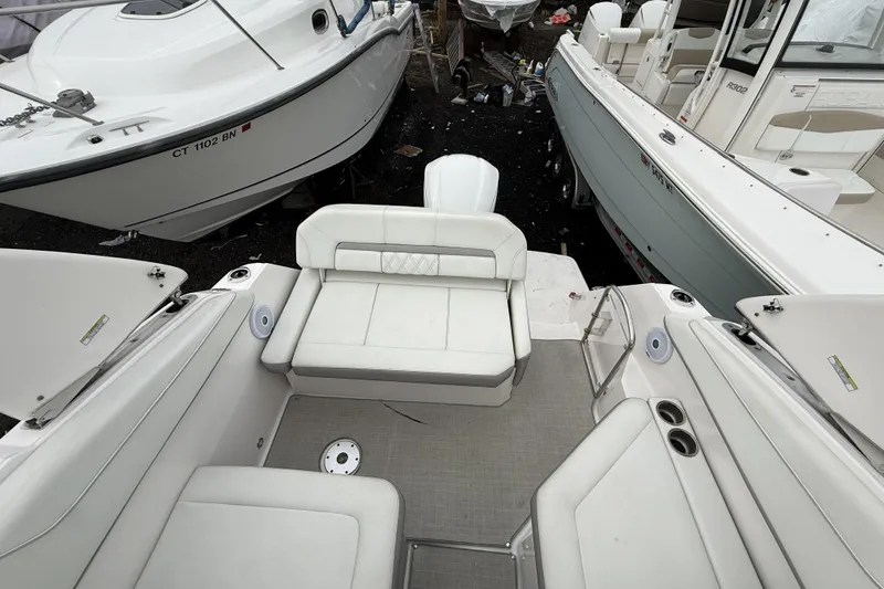 Slide: The Image of 2020 Regal 26 XO boat interior with white seating and deck area. - 6