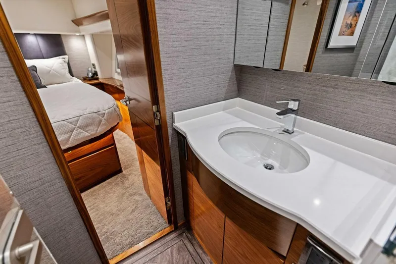 Slide: The Image of Luxurious 2023 Vikiing convertible yacht interior with modern bathroom and cozy bedroom. - 19