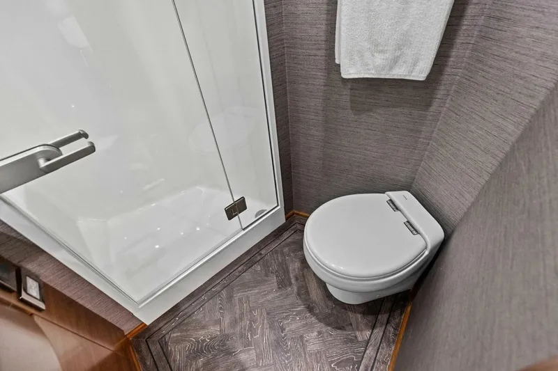 Slide: The Image of Modern bathroom in 2023 Vikiing convertible, featuring sleek toilet and glass shower. - 20