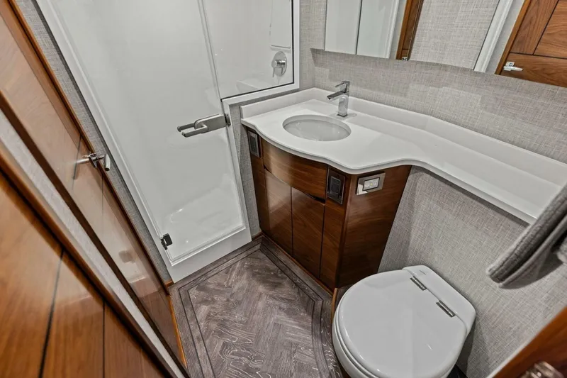 Slide: The Image of Luxurious 2023 Vikiing convertible bathroom with modern fixtures and elegant wood accents. - 25