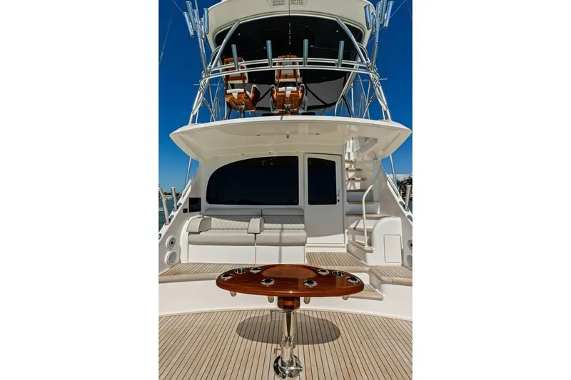 Slide: The Image of 2023 Vikiing convertible yacht with luxurious deck and seating area. - 33