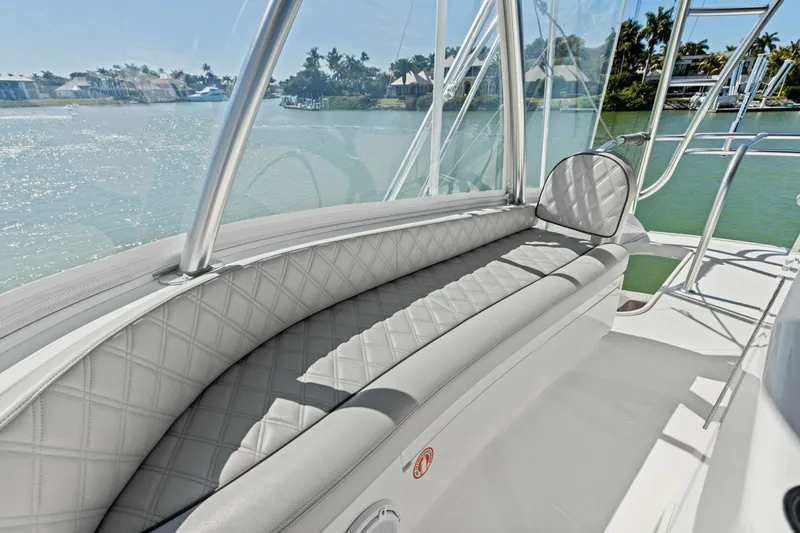 Slide: The Image of Luxurious seating on 2023 Vikiing convertible boat with scenic waterfront view. - 46