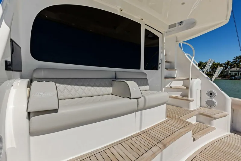 Slide: The Image of Luxurious 2023 Vikiing convertible yacht interior with elegant seating and wooden steps. - 50
