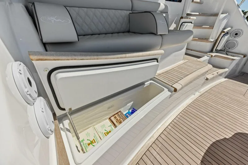 Slide: The Image of 2023 Vikiing convertible yacht with open storage compartment on deck. - 54