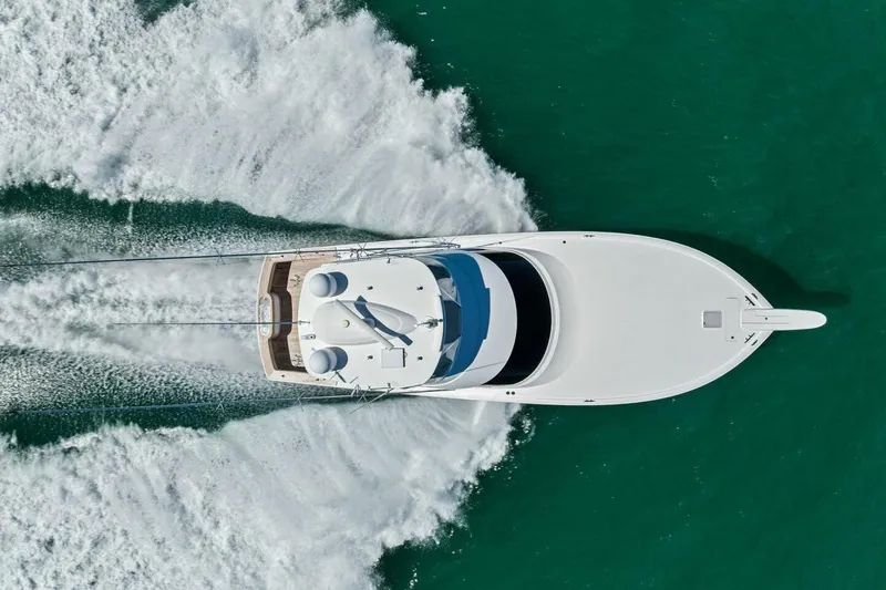 Slide: The Image of Aerial view of 2023 Vikiing convertible yacht cruising on turquoise water. - 73