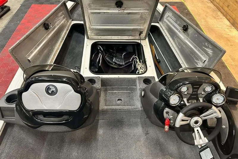 Slide: The Image of 2019 Tracker Pro Team 175 TXW Tournament Edition boat interior with open storage compartments. - 4