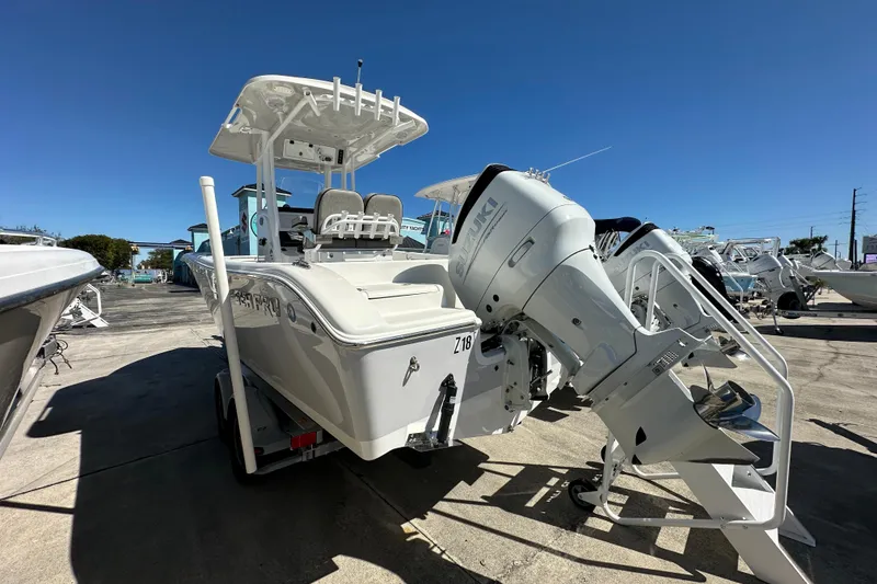 Slide: The Image of 2023 Sea Pro 239 Deep V CC boat with Suzuki outboard motor, displayed outdoors. - 3