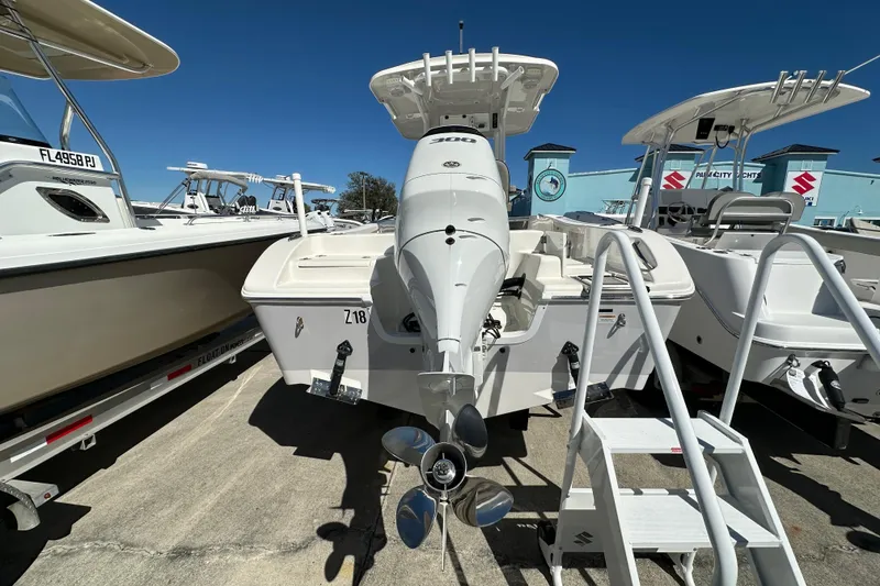 Slide: The Image of 2023 Sea Pro 239 Deep V CC boat with outboard motor, docked at marina. - 4