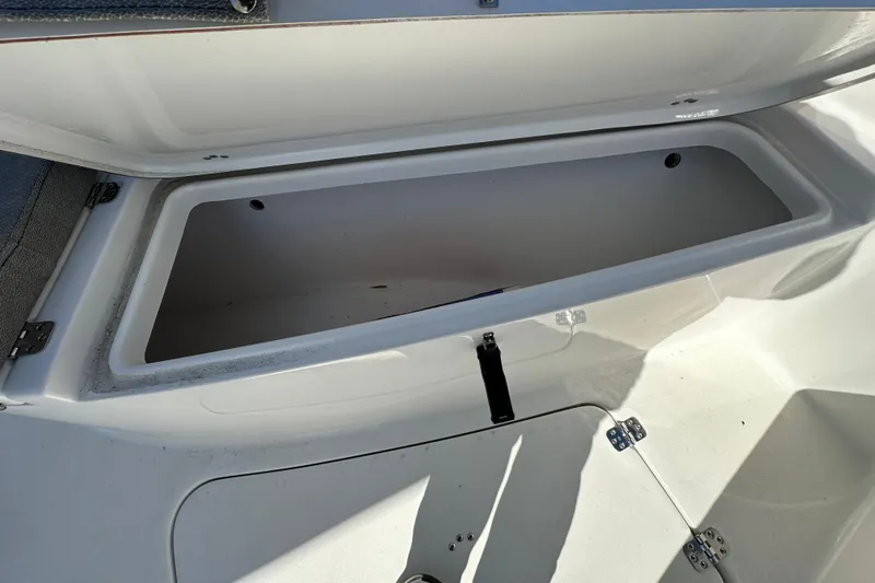 Slide: The Image of Open storage compartment on 2023 Sea Pro 239 Deep V CC boat. - 9
