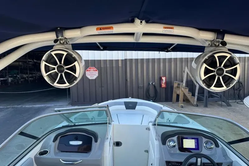Slide: The Image of 2022 Chapparall 21 SSi boat interior with speakers and dashboard view. - 3