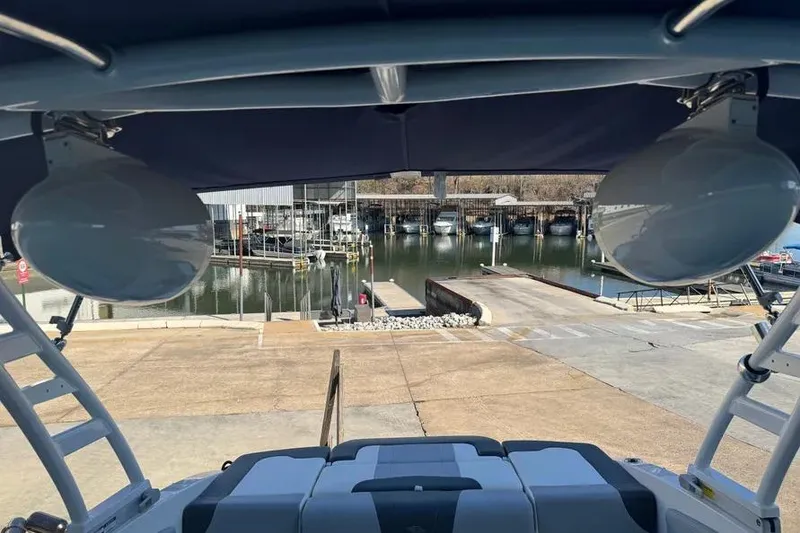 Slide: The Image of 2022 Chapparall 21 SSi boat at marina, view from under canopy. - 4