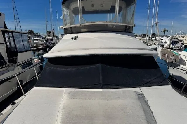 Slide: The Image of 1986 Carver 4207 Aft Cabin Motor Yacht docked in marina. - 12