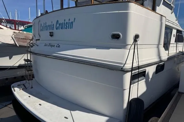 Slide: The Image of 1986 Carver 4207 Aft Cabin Motor Yacht docked in San Diego marina. - 4