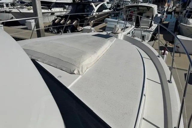 Slide: The Image of 1986 Carver 4207 Aft Cabin Motor Yacht docked at marina, top deck view. - 10