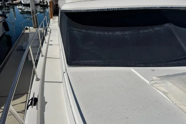 Slide: The Image of 1986 Carver 4207 Aft Cabin Motor Yacht deck view at marina. - 13
