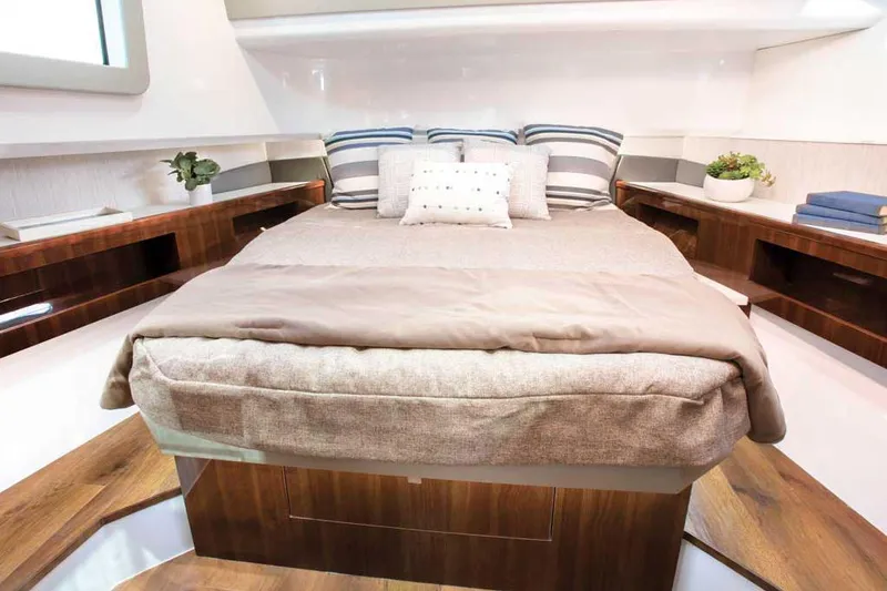 Slide: The Image of 2026 Cruisers Yachts 50 GLS on water, featuring modern design and luxury amenities. - 10