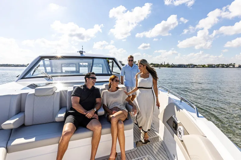 Slide: The Image of Luxurious interior of 2026 Cruisers Yachts 50 GLS with modern wood finish and cozy seating. - 43