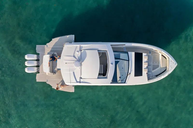 Slide: The Image of Luxurious bathroom interior of 2026 Cruisers Yachts 50 GLS with modern sink and wood accents. - 39