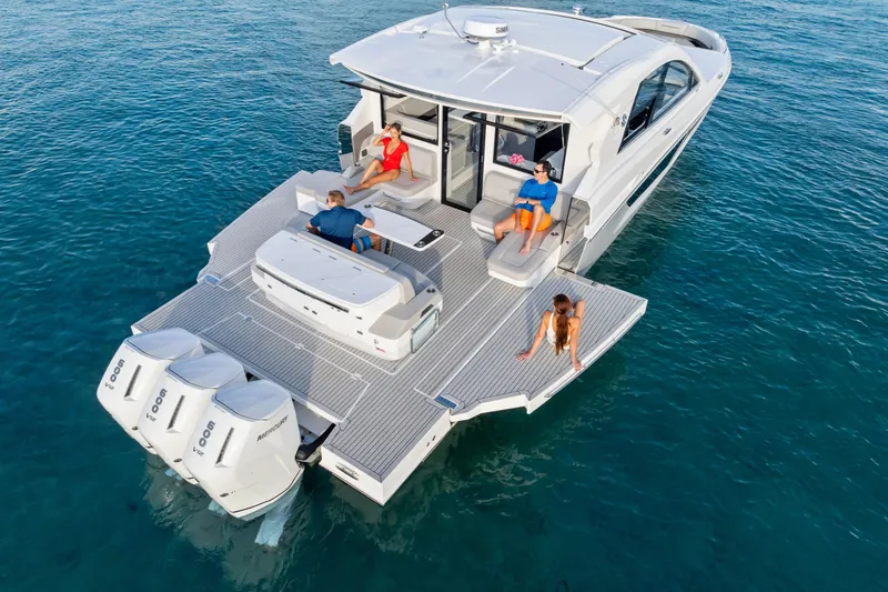 Slide: The Image of 2026 Cruisers Yachts 50 GLS on water, featuring spacious deck and powerful engines. - 5