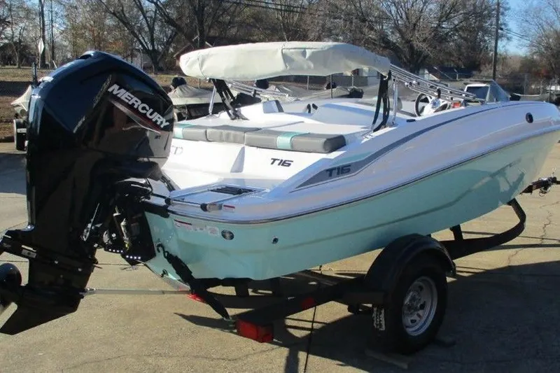 Slide: The Image of 2026 Tahoe T16 boat with Mercury engine on trailer, parked outdoors. - 3