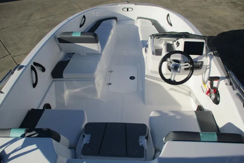 Slide: The Image of 2026 Tahoe T16 boat interior with modern steering and seating arrangement. - 5