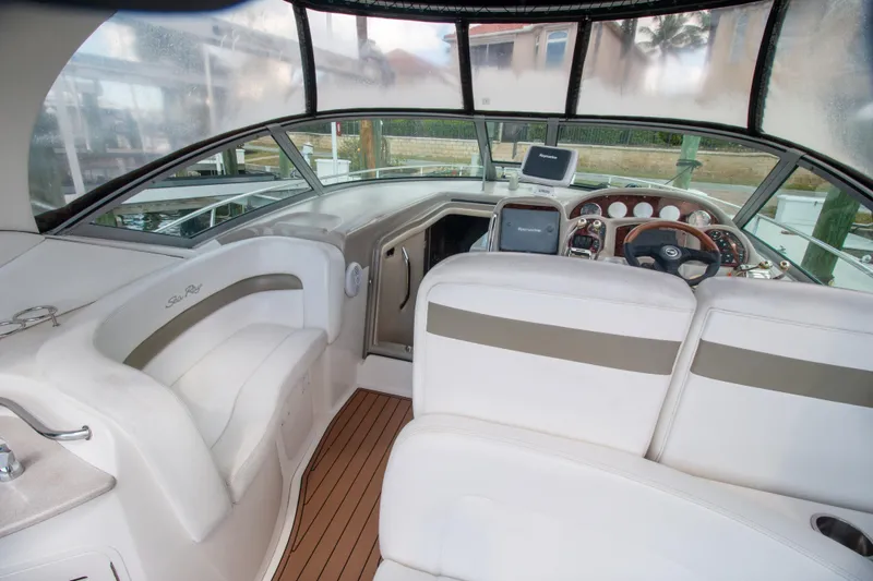 Slide: The Image of Interior of 2006 Sea Ray Sundancer 320 boat with helm and seating area. - 13