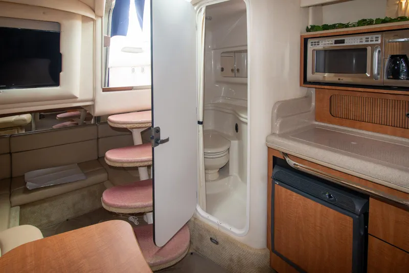 Slide: The Image of Interior of 2006 Sea Ray Sundancer 320 yacht with kitchenette and bathroom. - 35