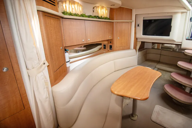 Slide: The Image of Luxurious interior of 2006 Sea Ray Sundancer 320 yacht with elegant seating and wooden cabinetry. - 36