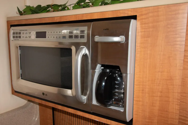 Slide: The Image of Built-in microwave and coffee maker on a 2006 Sea Ray Sundancer 320 yacht. - 42
